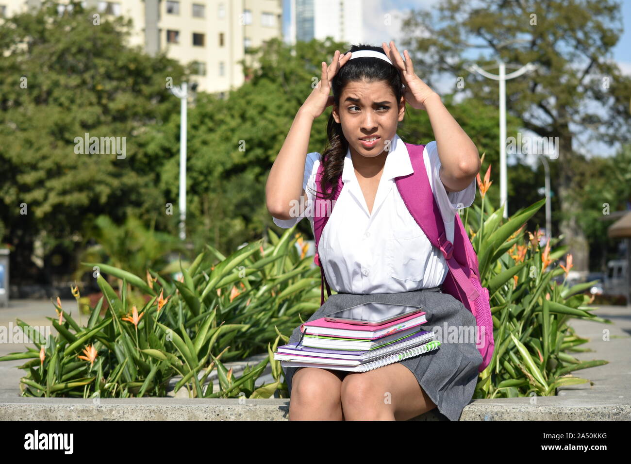 Cute Student stress adolescent School Girl Sitting Banque D'Images