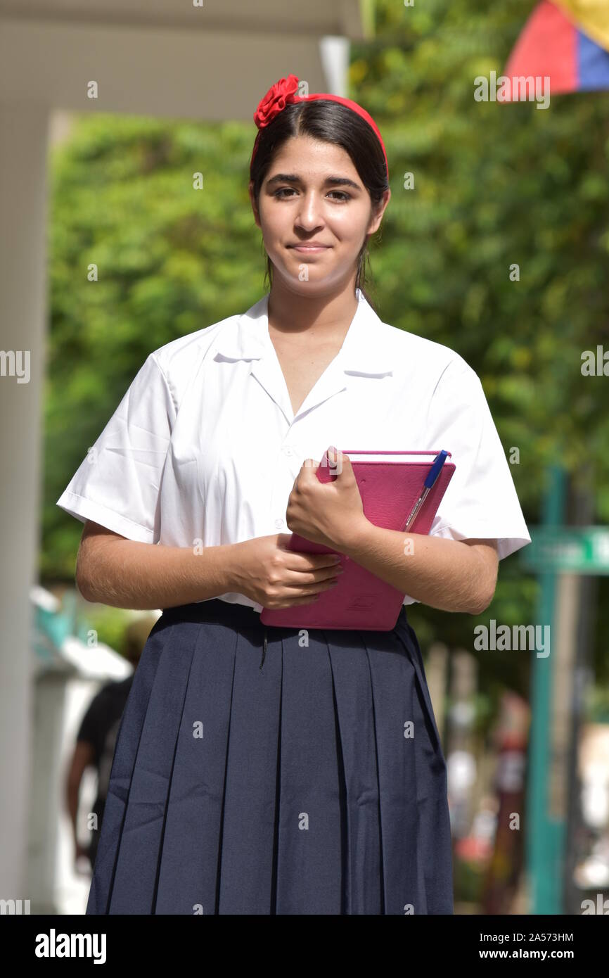 L'étudiant adolescent flegmatique School Girl Wearing School Uniform Banque D'Images