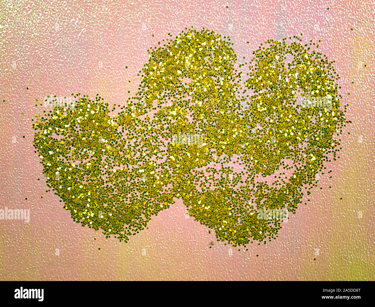 Surface en forme de cœur , gold glitter background. Banque D'Images