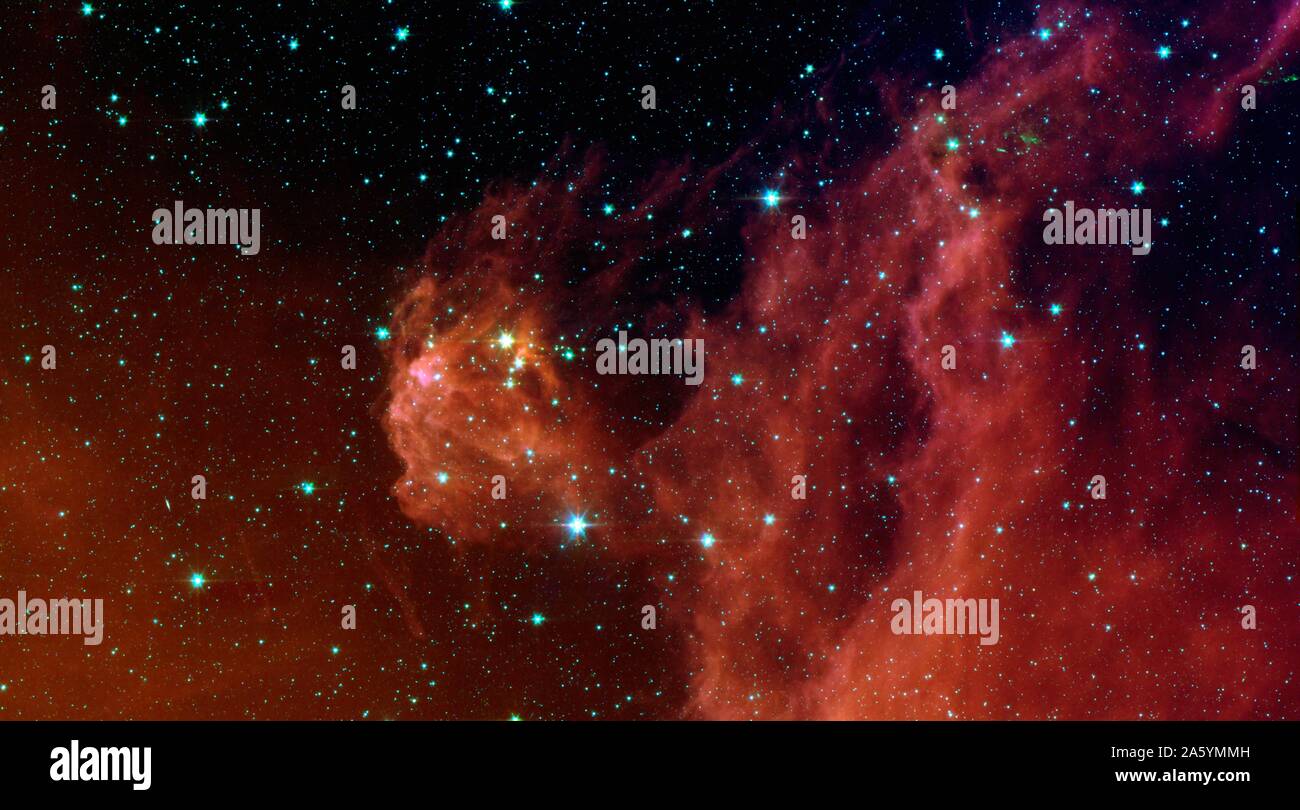 Stars 'bébé' à couver dans la tête de la constellation Orion, chasseur. La région en vedette dans cette image est appelée Barnard 30. Il est situé à environ 1 300 années-lumière et se trouve sur le côté droit de Orion's 'tête', juste au nord de l'étoile massive de Lambda Orionis. Le télescope spatial Spitzer. Banque D'Images
