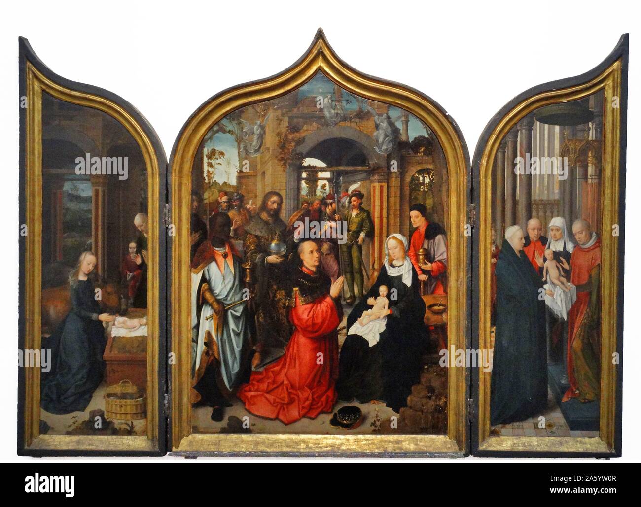 Triptyque : La Nativité, l'Adoration des Mages, La Présentation au Temple par Adriaen Isenbrandt (1480-1551) peintre flamand de la Renaissance du Nord. En date du 16e siècle Banque D'Images