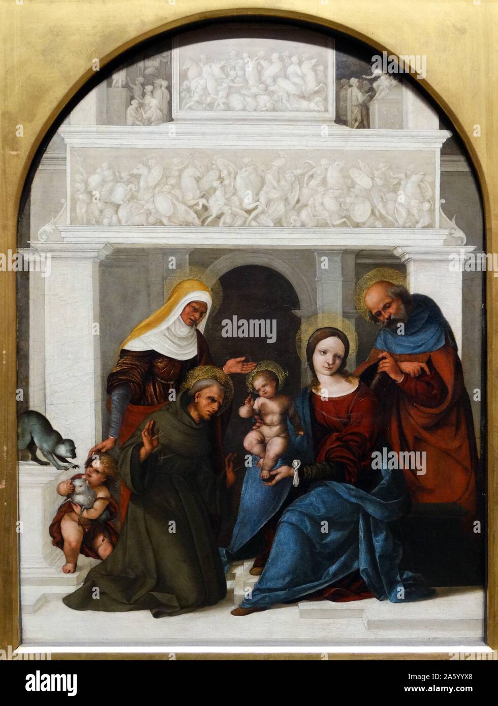 La peinture intitulée "La Sainte Famille avec saint François' par Lodovico Mazzolino (1480-1528) peintre de la Renaissance italienne. Datée 1509 Banque D'Images
