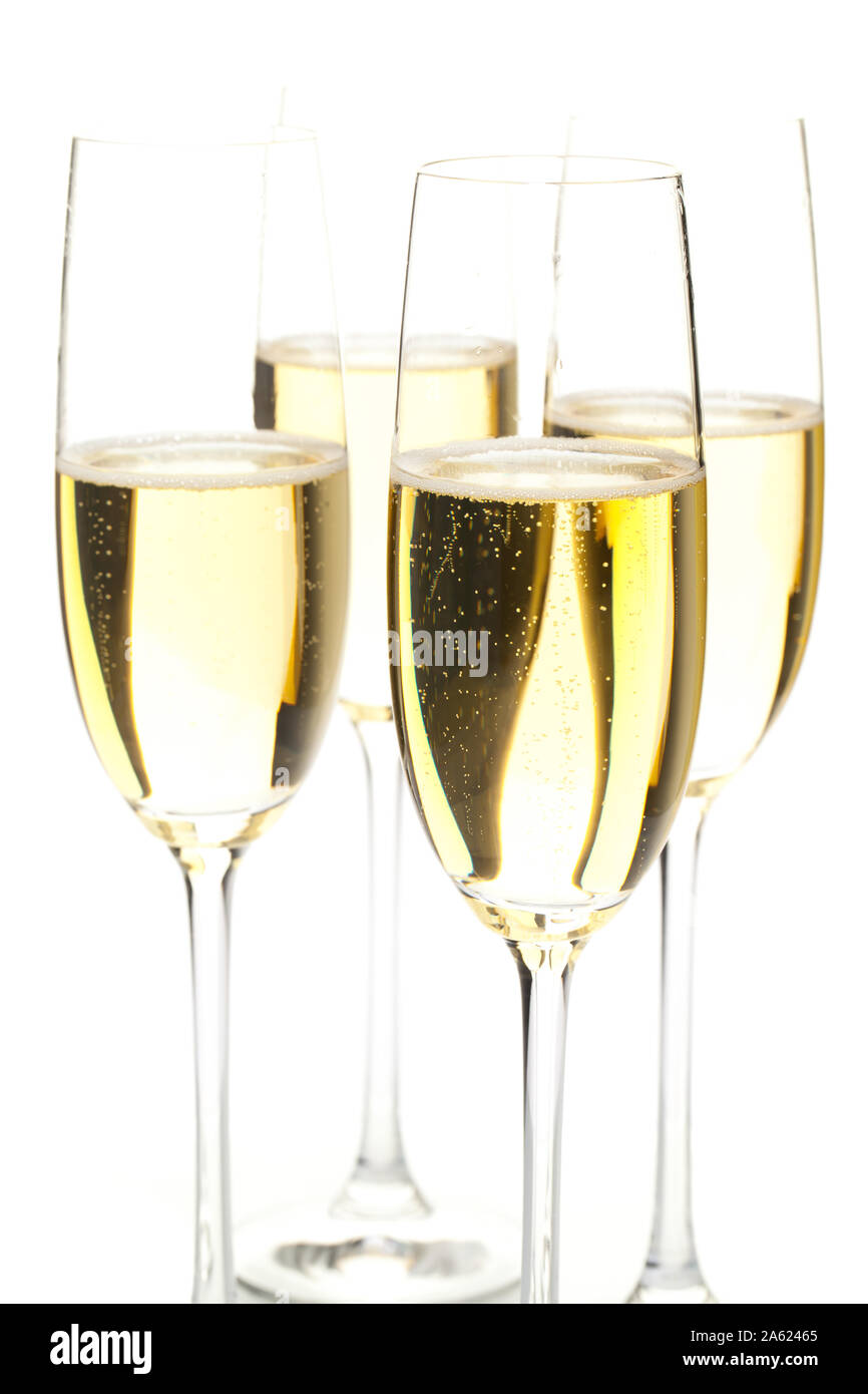 Quatre verres de champagne in front of white background Banque D'Images