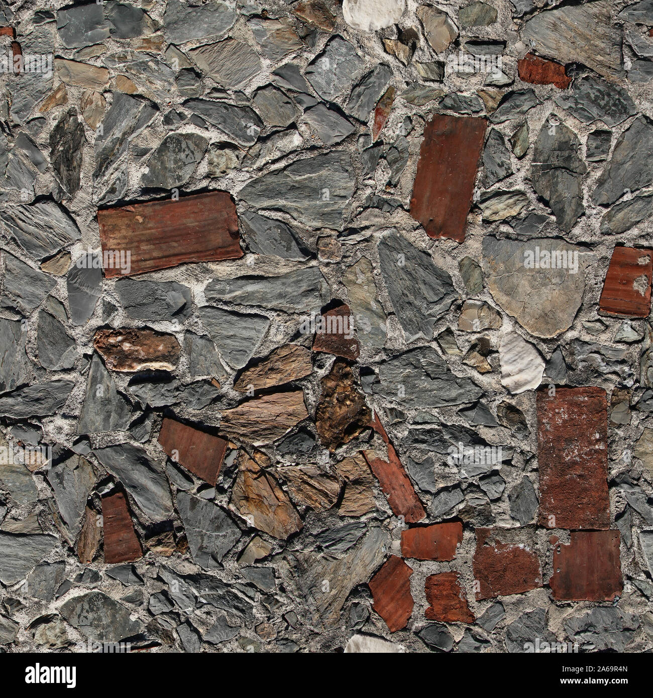 Seamless texture de pavage trottoir faites de morceaux de pierre empilées au hasard et carreaux de céramique. Pise. L'Italie. Banque D'Images