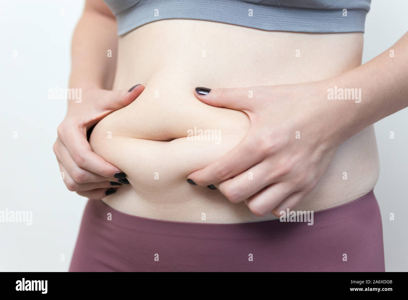 Close up of woman taille gros ventre, poignées d'amour Banque D'Images
