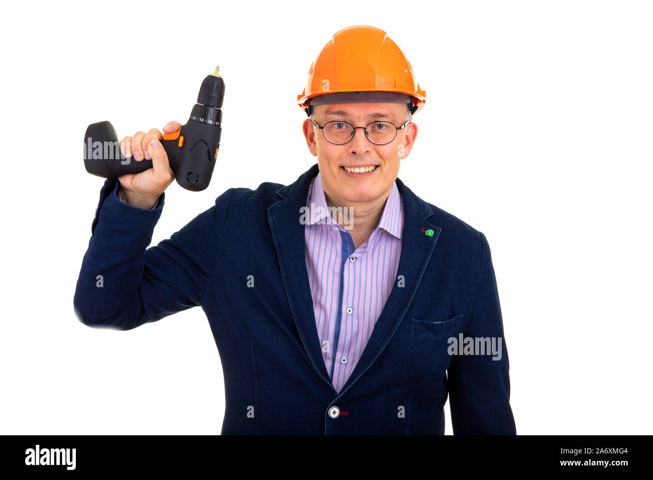 Homme dans un casque de construction et d'une perceuse Banque D'Images