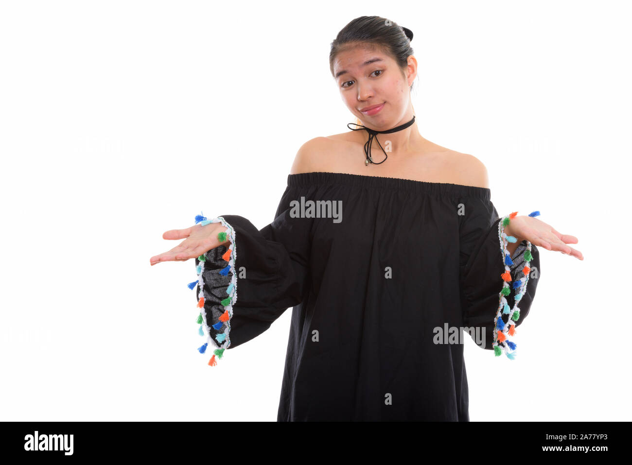 Studio shot of young Asian woman against white background Banque D'Images
