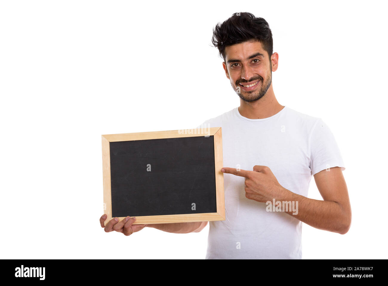 Portrait of young man holding persans barbus tableau noir Banque D'Images