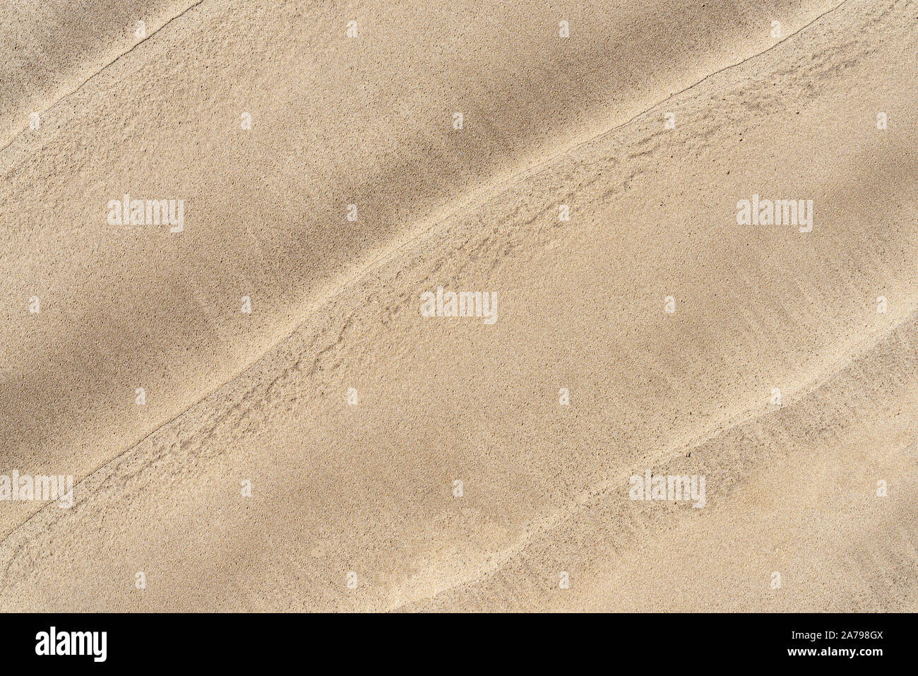 Vue de dessus de vagues sur fond de plage de sable Banque D'Images