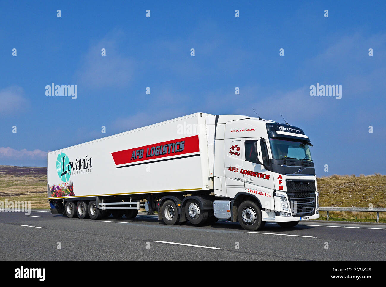 Le VHG Logistique AFB avec Lovania forestières Ltd remorque. Autoroute M6, Southbound, Shap, Cumbria, Angleterre, Royaume-Uni, Europe. Banque D'Images