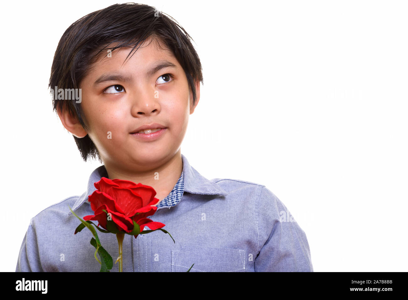 Studio shot of Japanese boy isolés contre fond blanc Banque D'Images