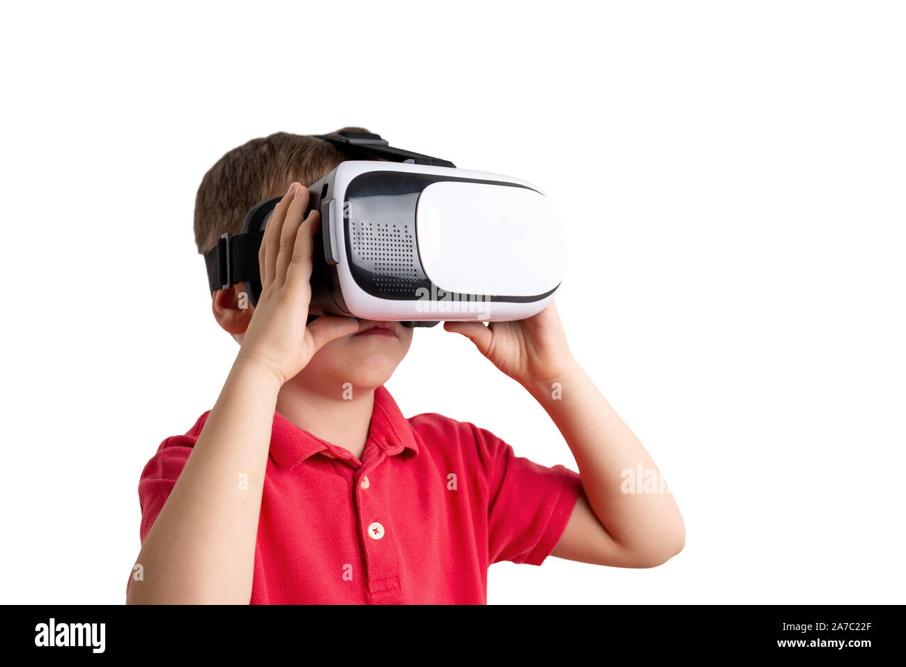 Garçon isolé avec casque de réalité virtuelle. Banque D'Images