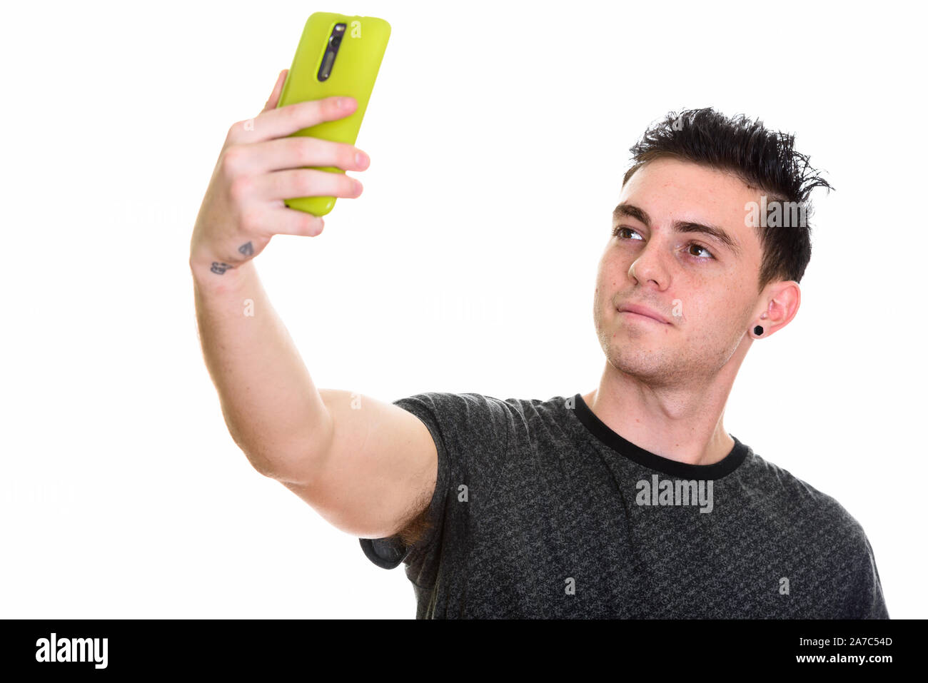 Studio shot of young handsome man isolated against white background Banque D'Images