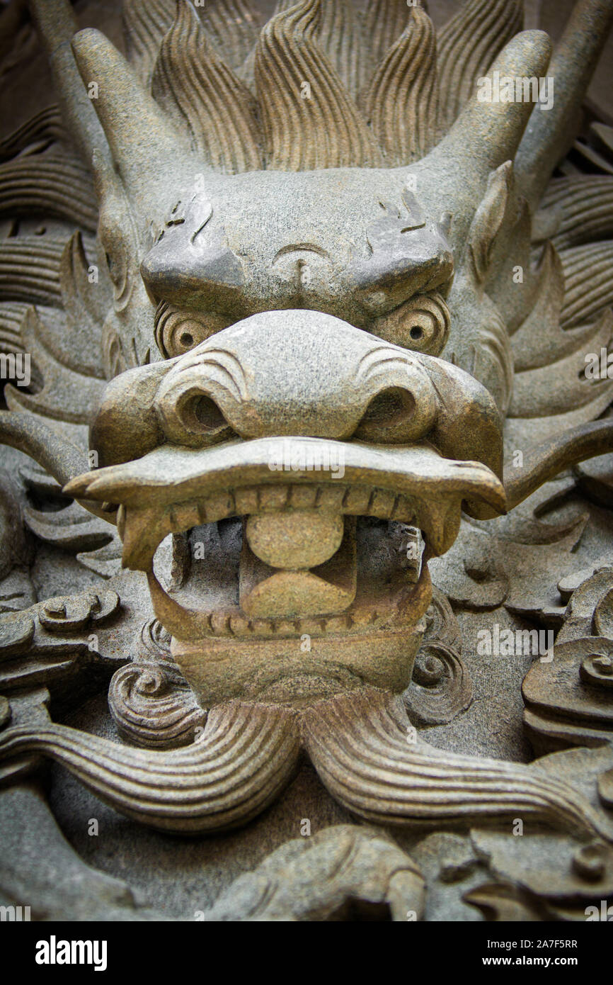 Tête de dragon chinois sculpté Banque D'Images