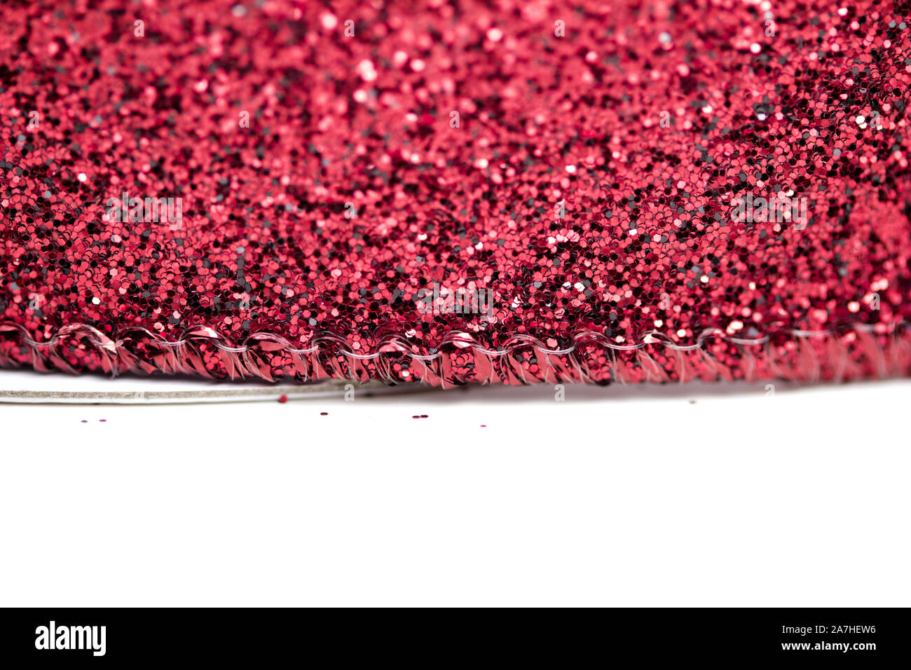 Macro fond lumineux de beaux mousseux rouge glitter ruban tissu texture avec bokeh Banque D'Images