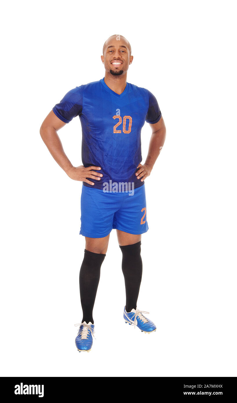 Une happy smiling African American soccer player debout dans son uniforme dans le studio, smiling, isolée pour fond blanc Banque D'Images
