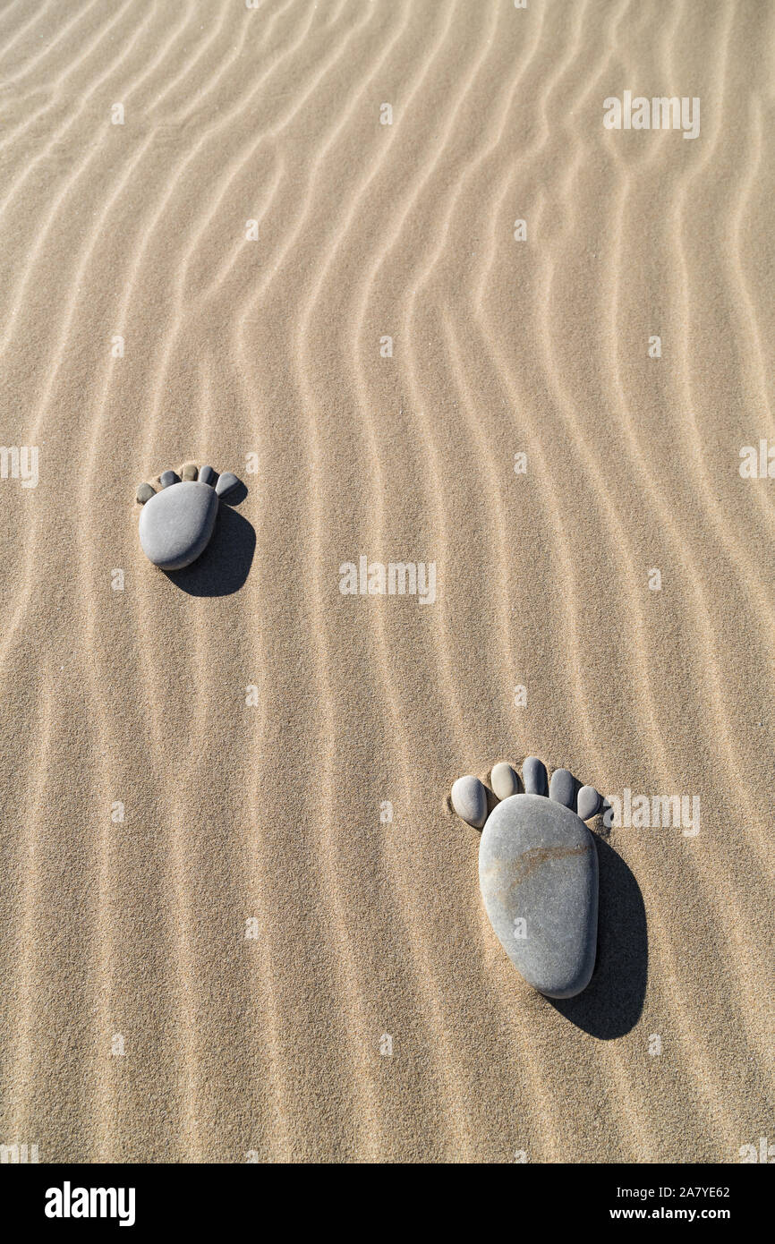 A l'empreinte de galets sur le sable Banque D'Images