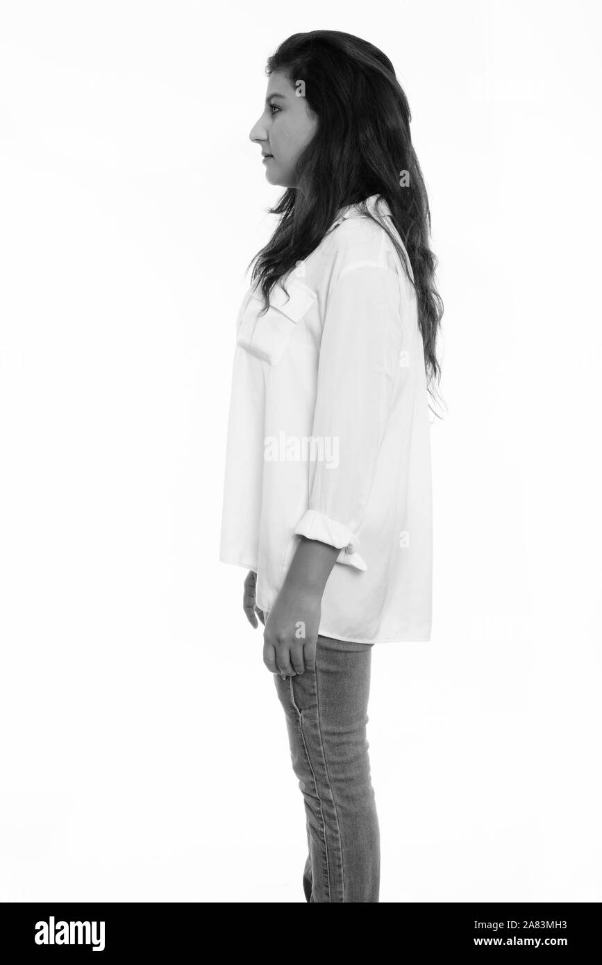 Voir le profil de belle jeune femme debout persan Banque D'Images Voir le profil de belle jeune femme debout persan Banque D'Images