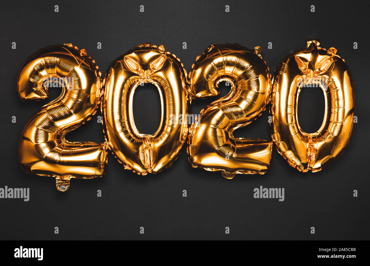 Bonne année 2020 célébration. Or, les chiffres lumineux Ballons Ballons  Nouvel An avec glitter sur fond sombre. Noël et nouvel an celebra Photo  Stock - Alamy