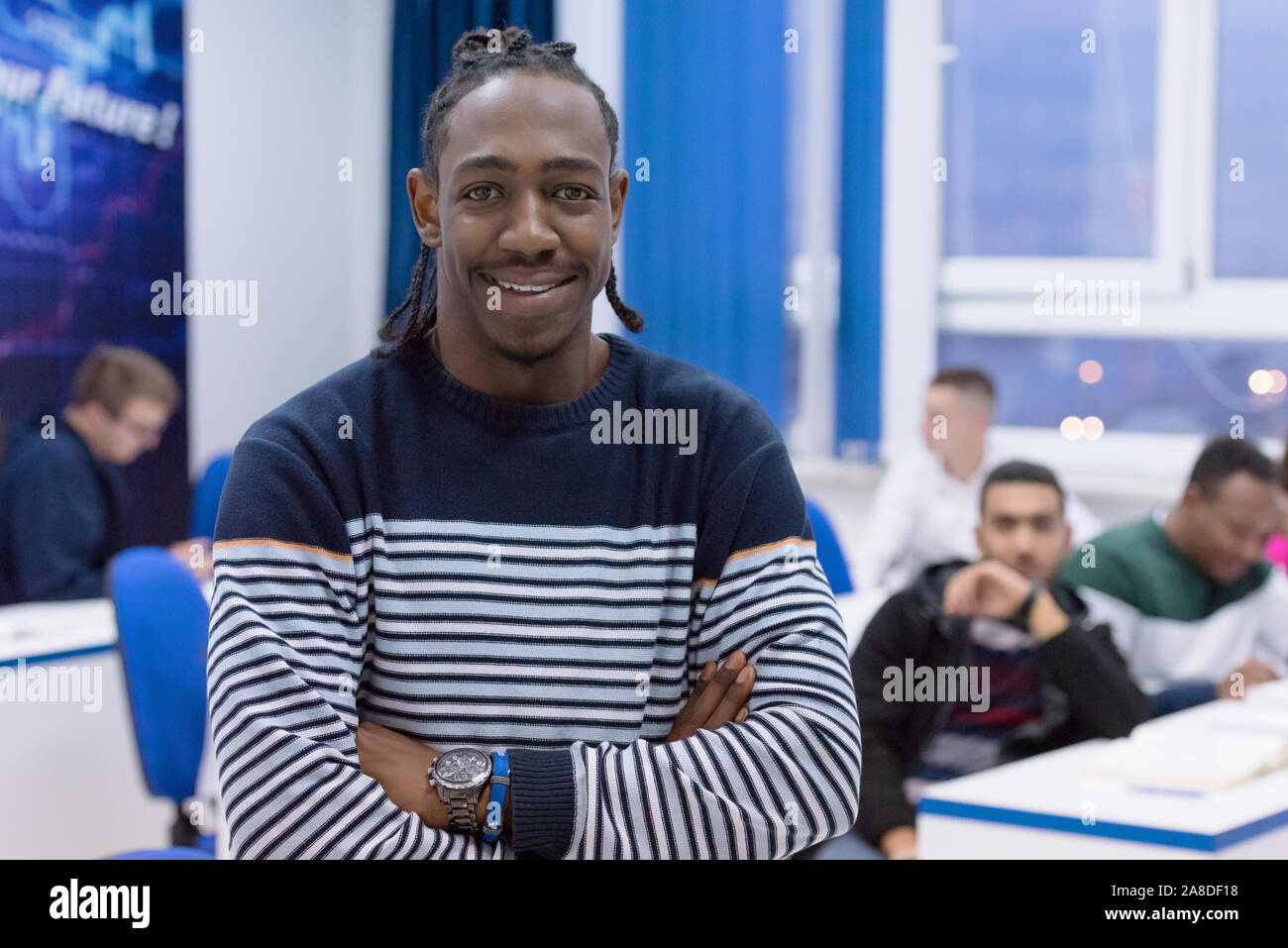 African American university students in class smiling at the camera. Banque D'Images