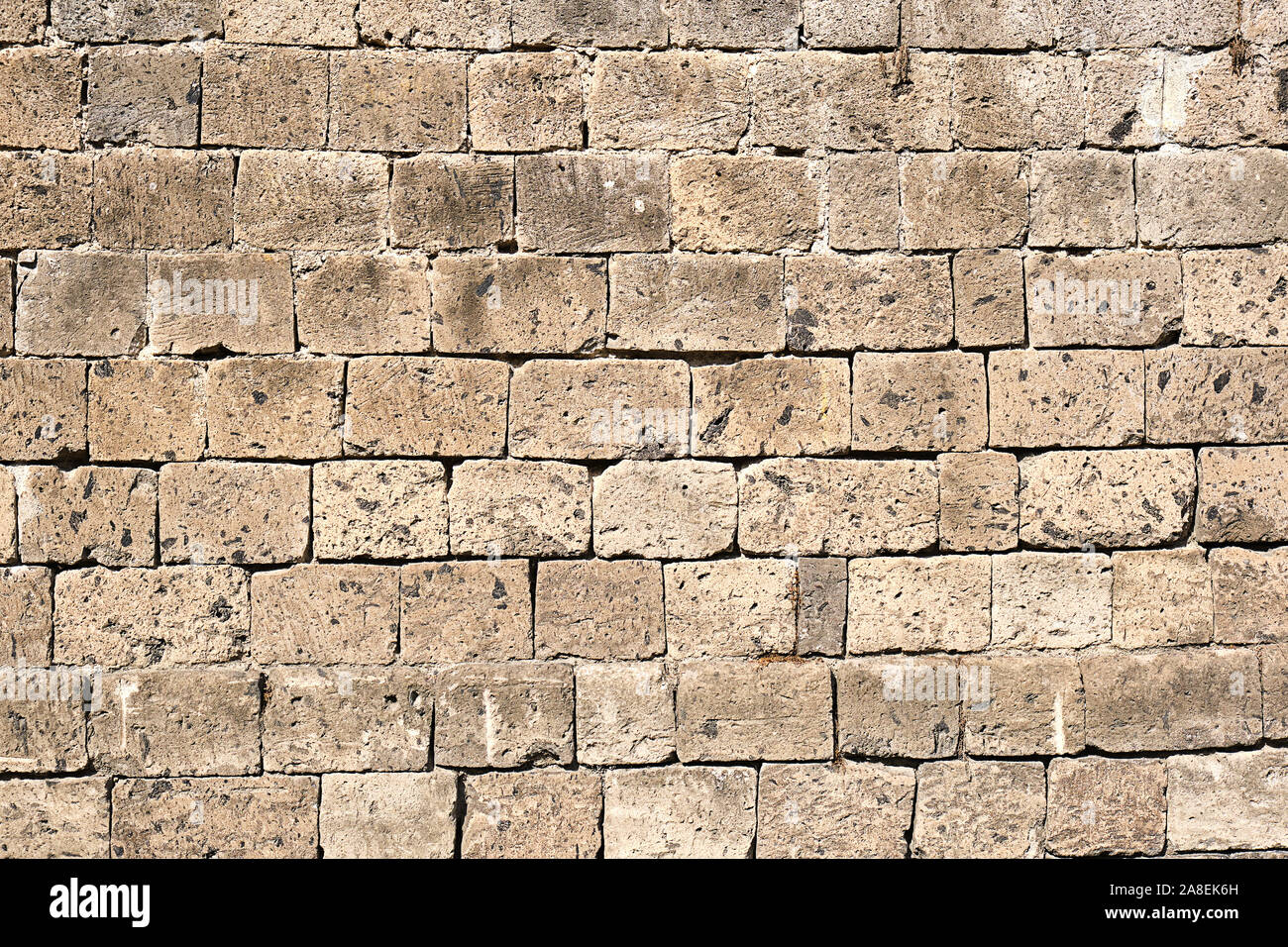 Arrière-plan d'un mur en pierre naturelle beige Banque D'Images Arrière-plan d'un mur en pierre naturelle beige Banque D'Images