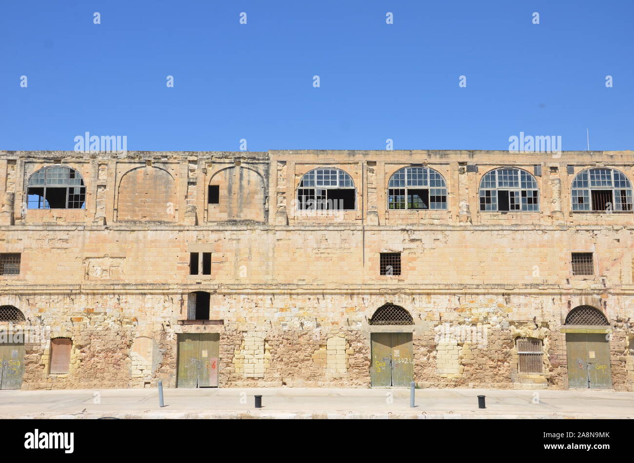 Entrepôts sur les quais de Birgu (Vittoriosa) Banque D'Images