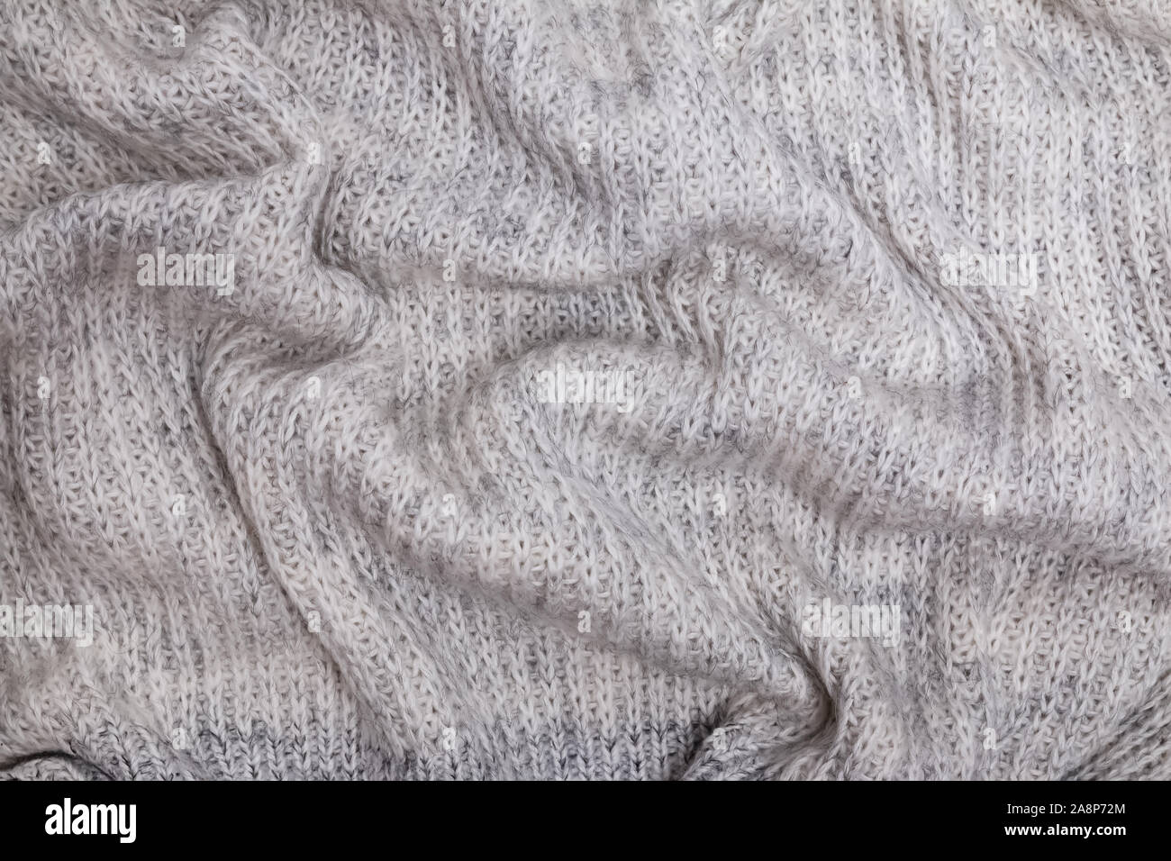La texture de laine tricoté chaud, pull ou un foulard de couleur gris Banque D'Images