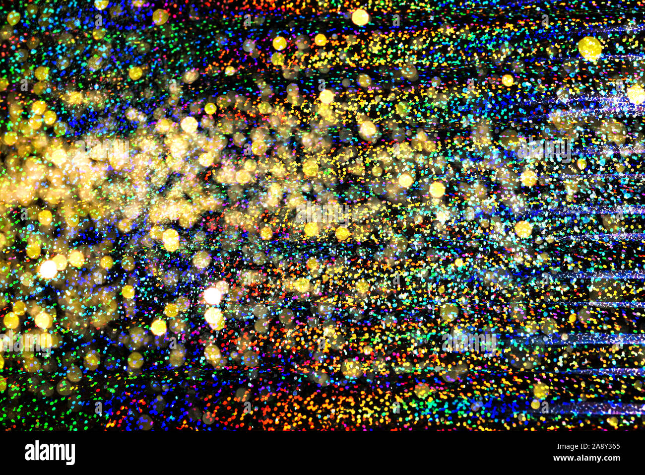 Photo de texture réelle holographique en couleurs arc-en-ciel de couleurs, surface irisée scintillante. Couleurs holographiques d'aluminium. Paillettes de couleur. Arrière-plan lumineux. Banque D'Images