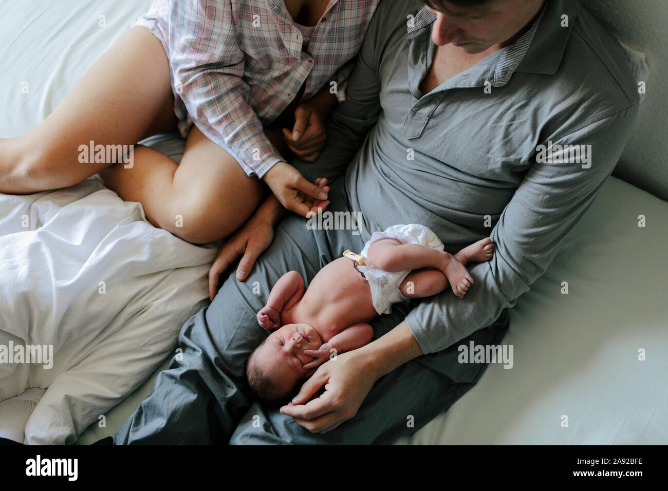 Famille dans son lit Banque D'Images