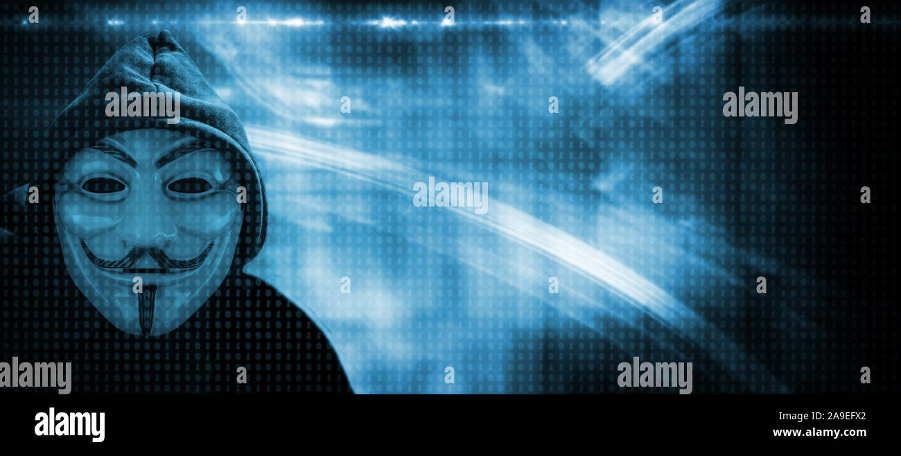 Pirate informatique anonyme avec masque et cagoule Banque D'Images