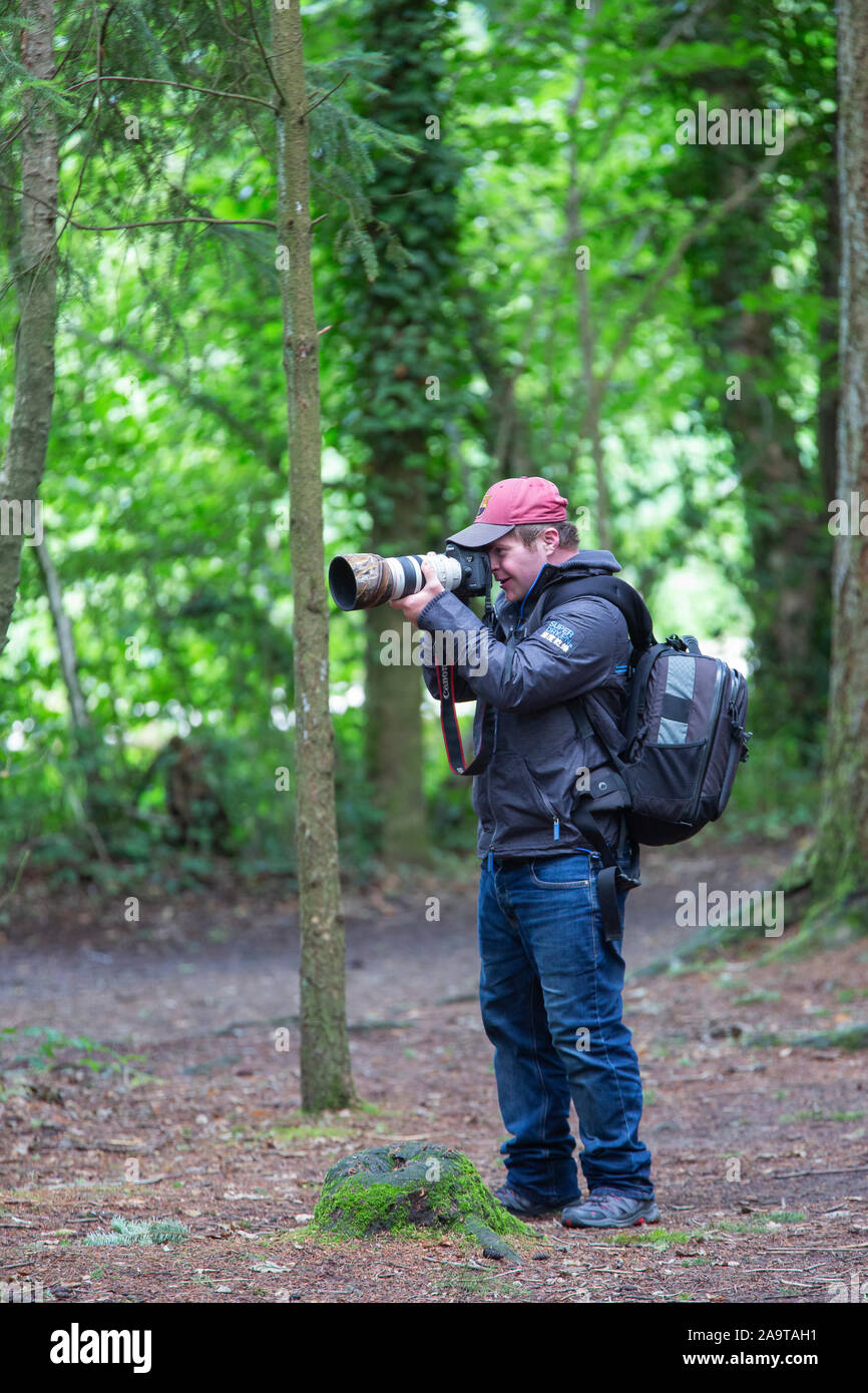 Oliver Hellowell photographe avec le syndrome de Down et sur la création de photographies de divertir ses fans facebook 65000 Banque D'Images