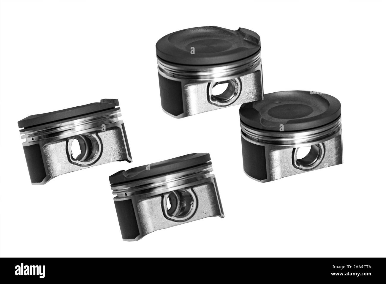 Les pistons d'un moteur à combustion interne à faible profondeur de champ sur un fond blanc Banque D'Images