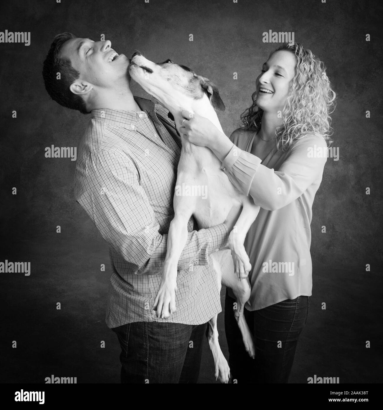 Studio shot of couple with dog Banque D'Images