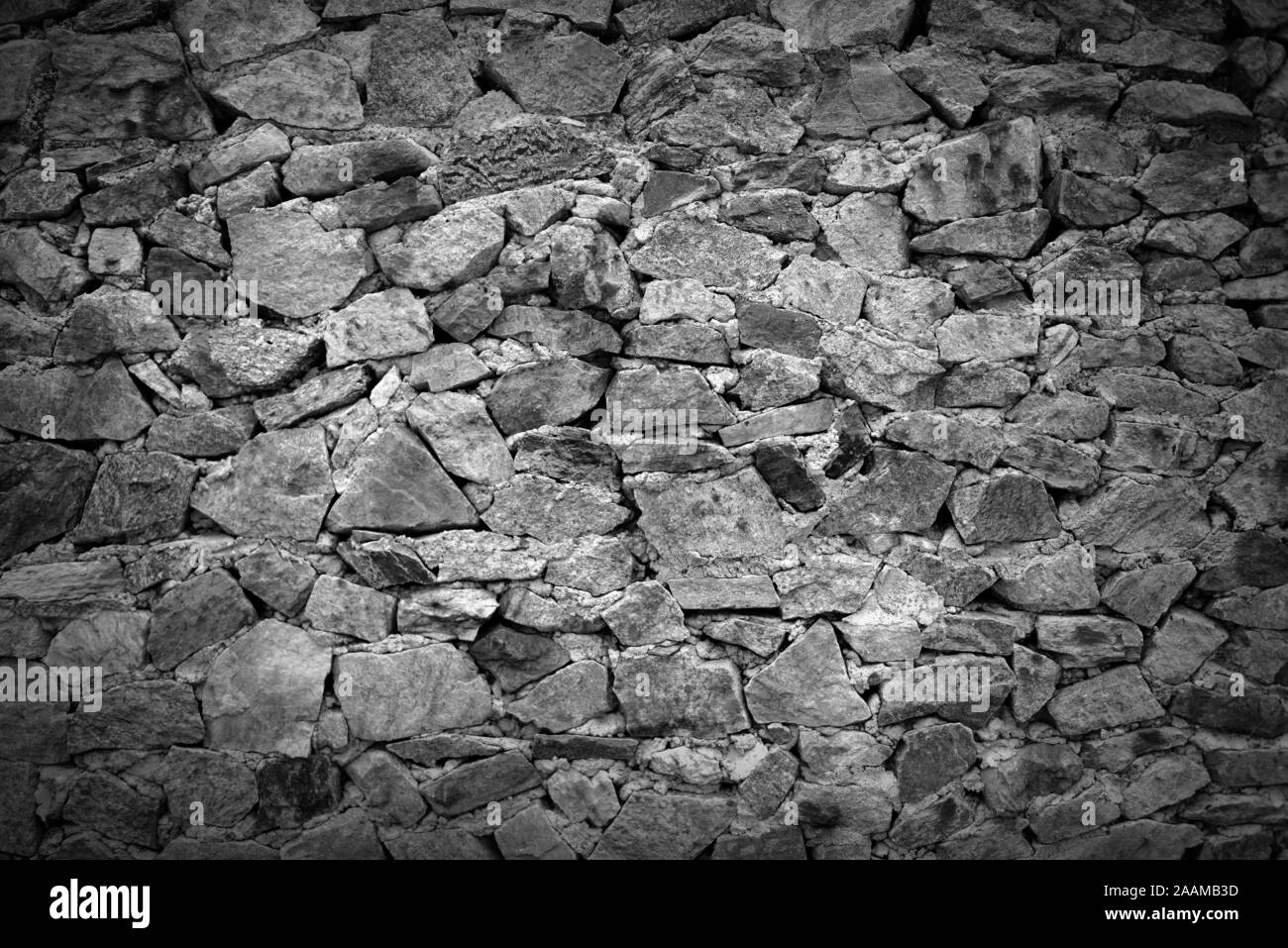 Arrière-plan de pierre, la texture de pierre mur de brique gris - close-up - Noir et Blanc Banque D'Images
