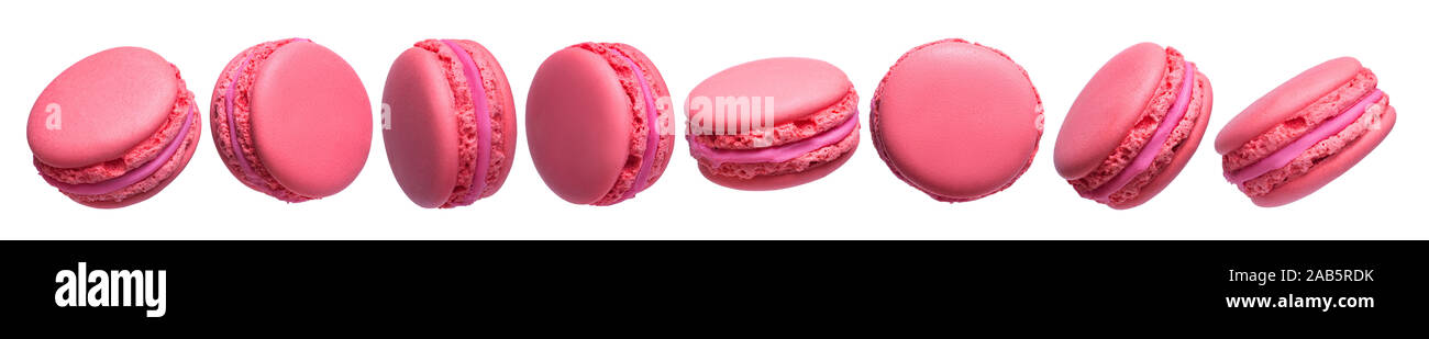 Jeu de gâteaux macarons français rose isolé sur fond blanc. Banque D'Images