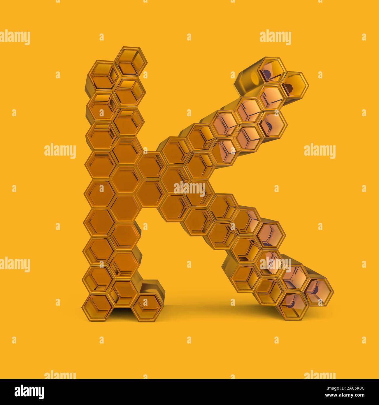 Lettre capitale K. en majuscules. Le miel font sur un fond jaune. Le rendu 3D Banque D'Images