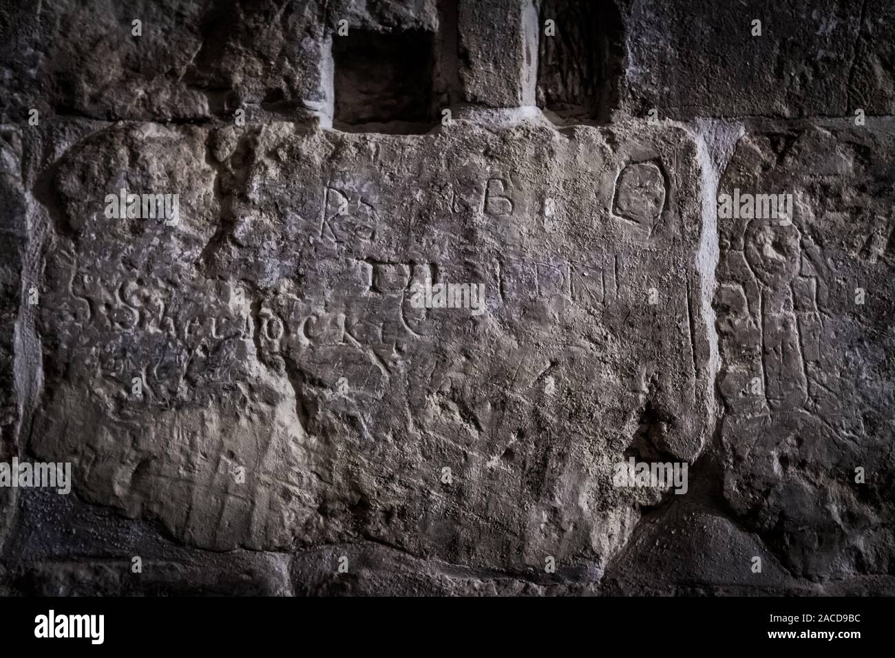 Vieux Graffiti sur la paroi cellulaire de la prison Banque D'Images