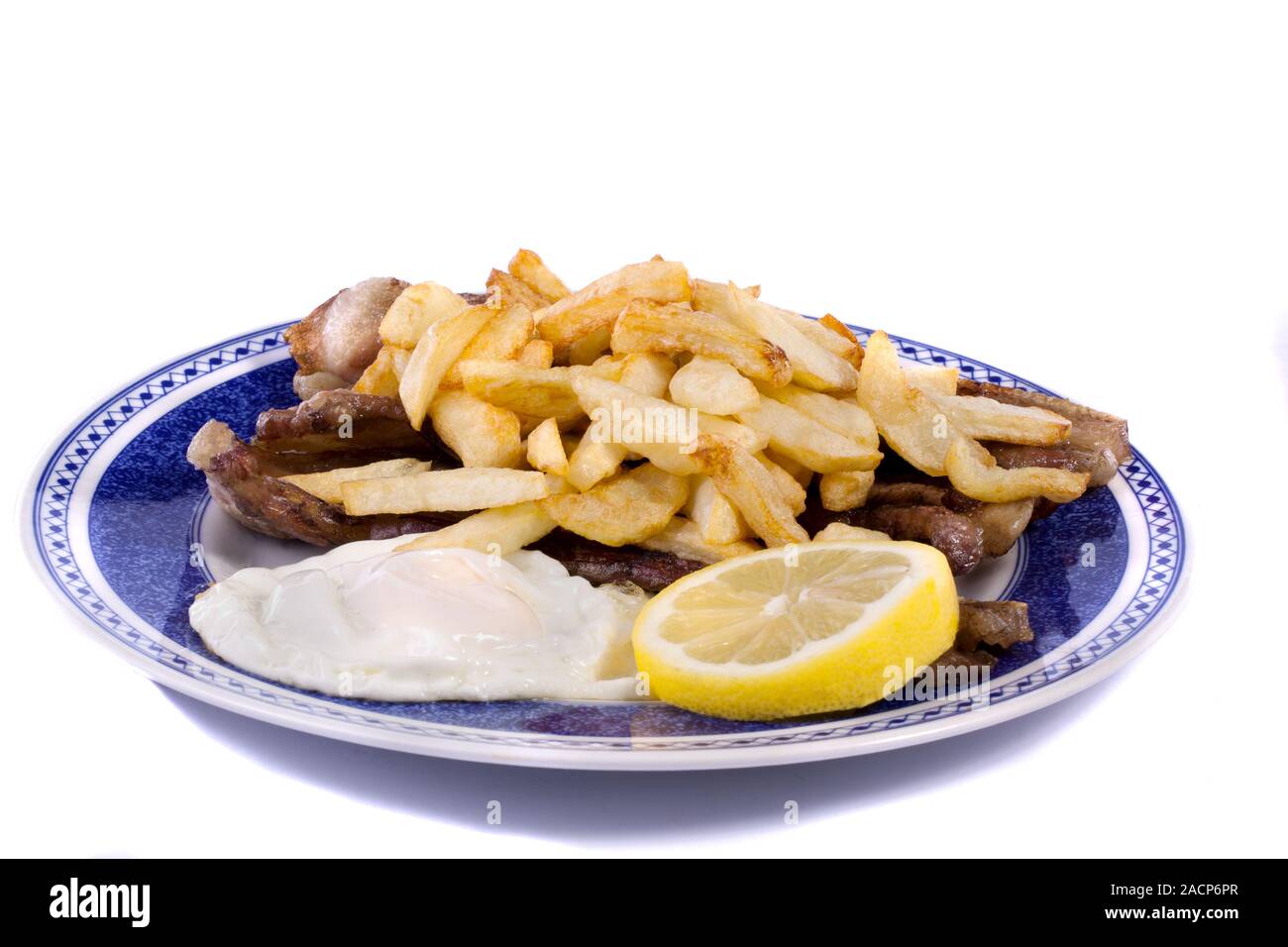 Pommes de terre frites avec des œufs et de la viande Banque D'Images