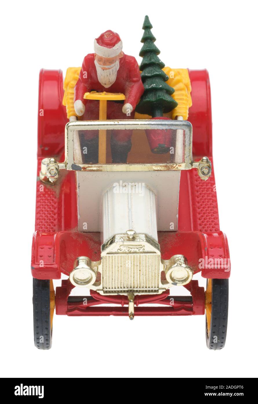 Père Noël dans une vieille Ford Motor Car. Dinky Toy en métal moulé avec le Père Noël et un arbre de Noël. Banque D'Images