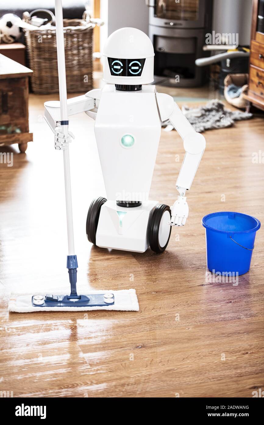 Robot laveur de sol automatique fait son travail dans une salle de séjour,  vertical tourné avec copyspace Photo Stock - Alamy