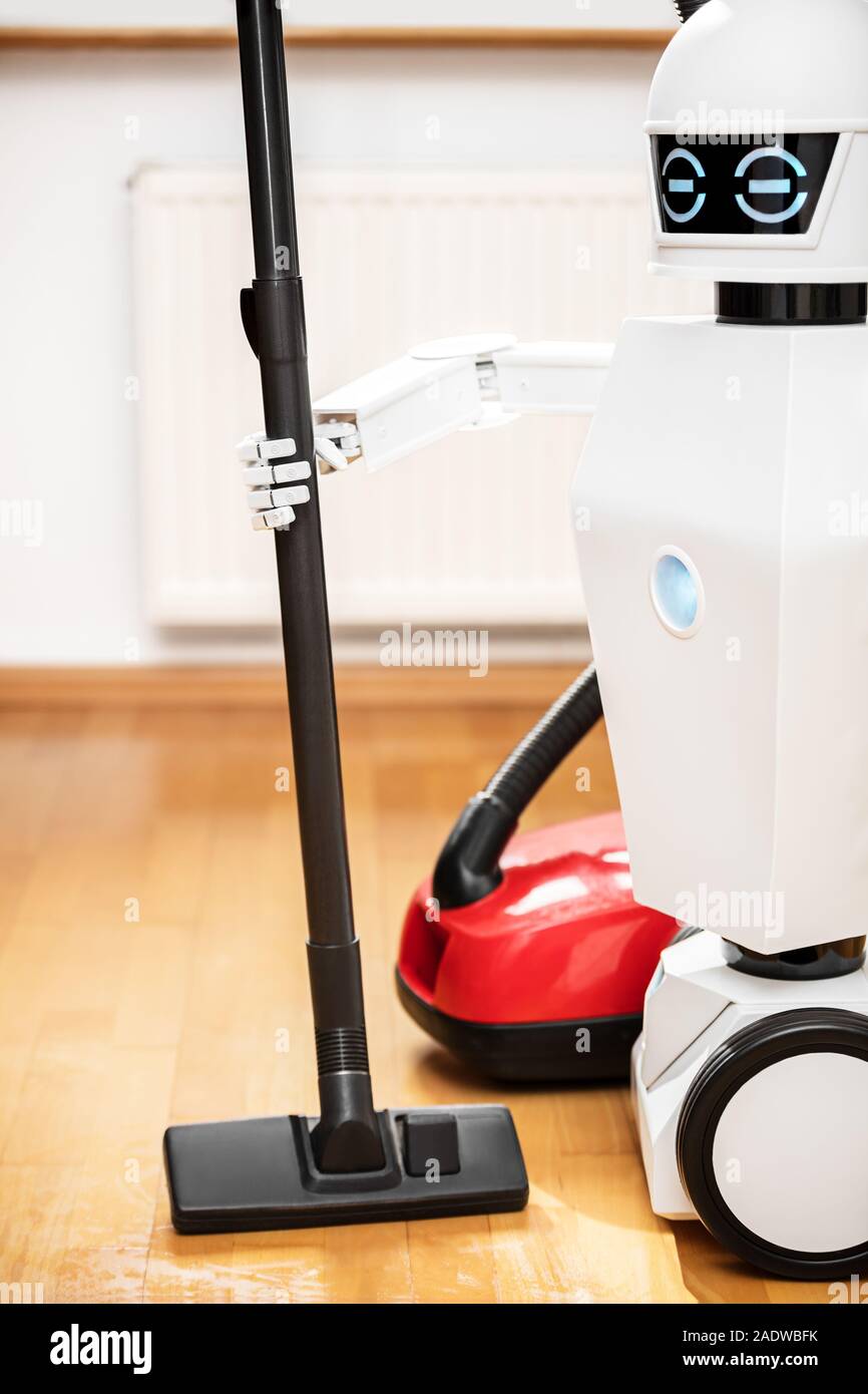 Robot blanc ou aspirateur robot ou robovac est le nettoyage de la chaussée  Photo Stock - Alamy
