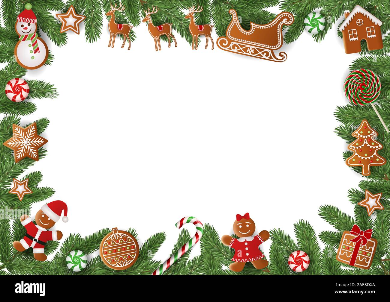 Cadre de Noël avec des branches de pins et gingerbreads Banque D'Images
