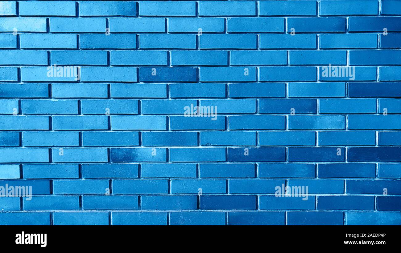 Fond bleu de brick wall texture pattern, d'écran conception modèle. Classic couleur bleue est la couleur de l'année 2020. Banque D'Images