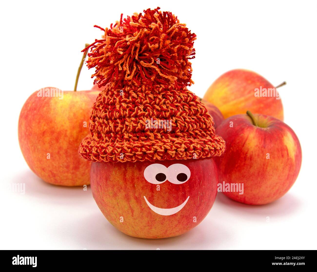 Apple avec drôle de visage et bobble hat Banque D'Images