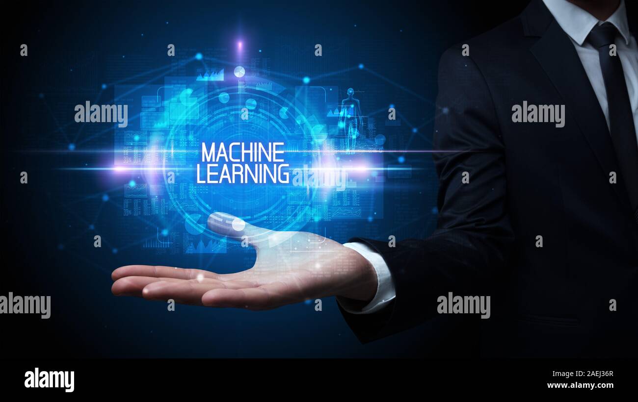 Man hand holding MACHINE LEARNING inscription, technologie concept Banque D'Images