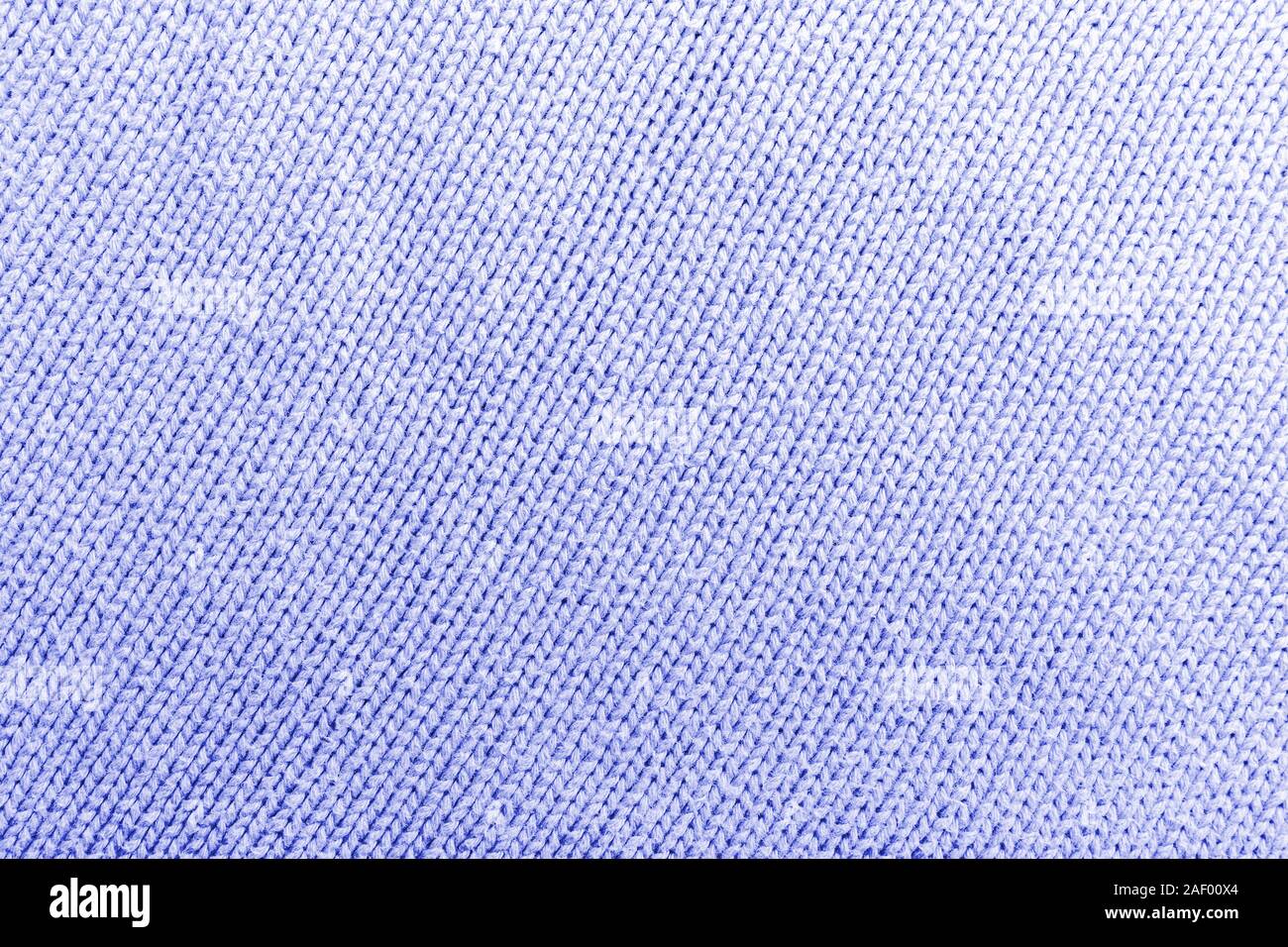 Laine tricot bleu classique de la texture pour l'arrière-plan. Close up de la trame bleue pour la conception de modèle. Pull chaud bleu fond textile Banque D'Images