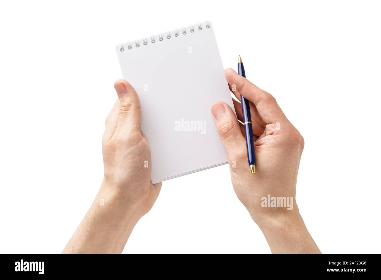 Male hands holding d'un bloc-notes et un stylo vide. L'homme de prendre des notes ou une liste à faire. Isolé sur fond blanc. Banque D'Images