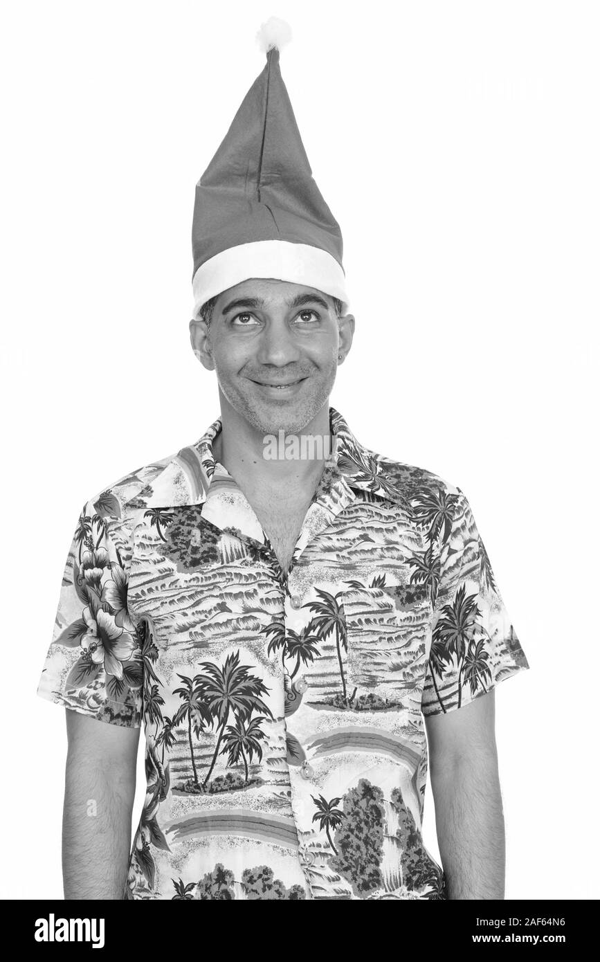 Happy mature man wearing Christmas hat persan Banque D'Images