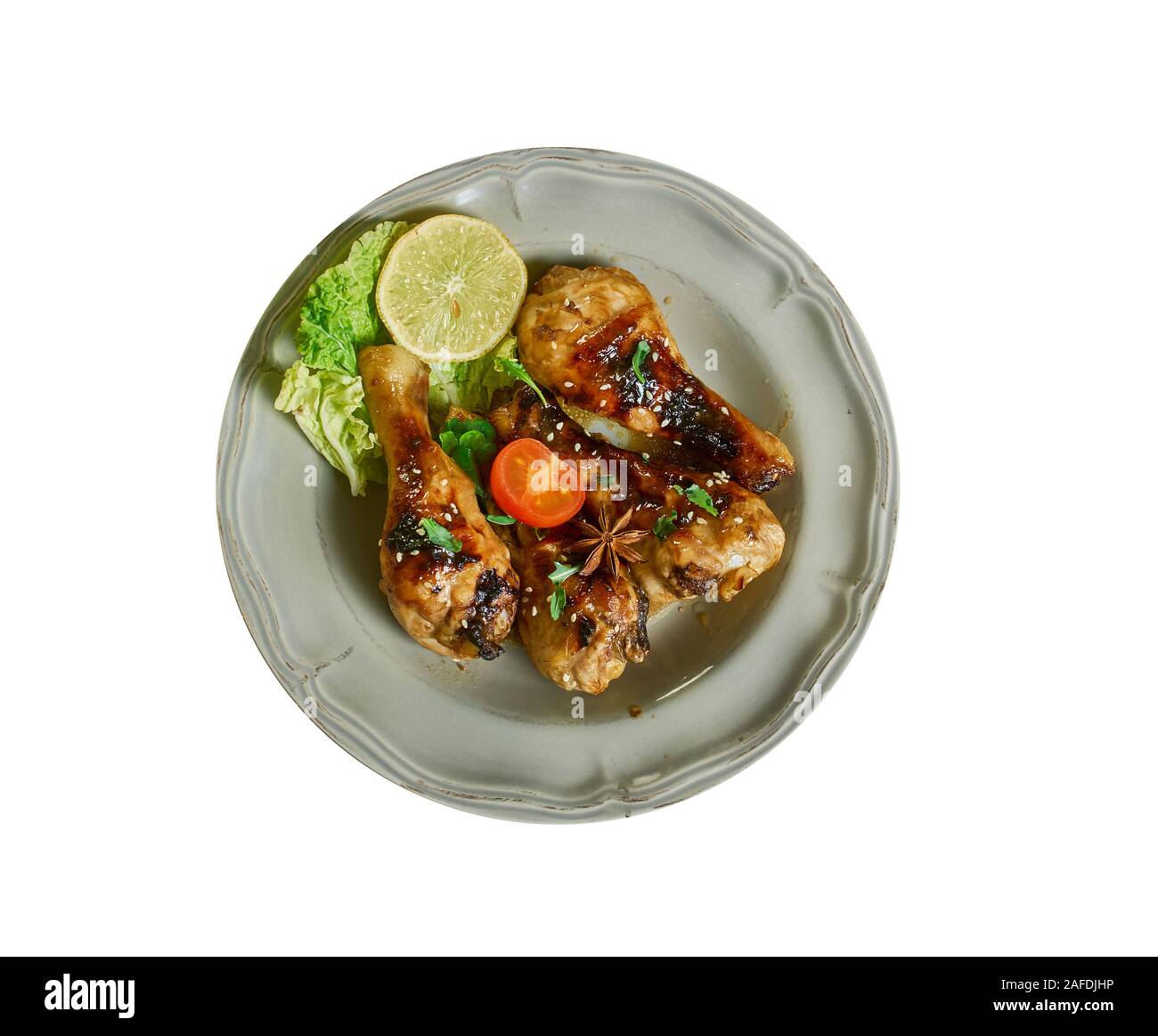 Pilons de poulet au miel - poêle ou casserole, mélanger la sauce soja, le vin de riz, le miel, l'ail, gingembre et sriracha dans une poêle Banque D'Images