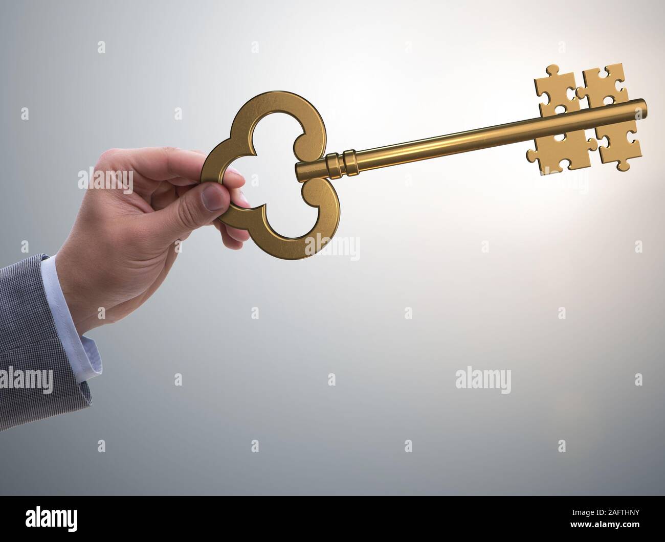 L'homme d'affaires avec les principaux et jigsaw puzzle pieces Banque D'Images